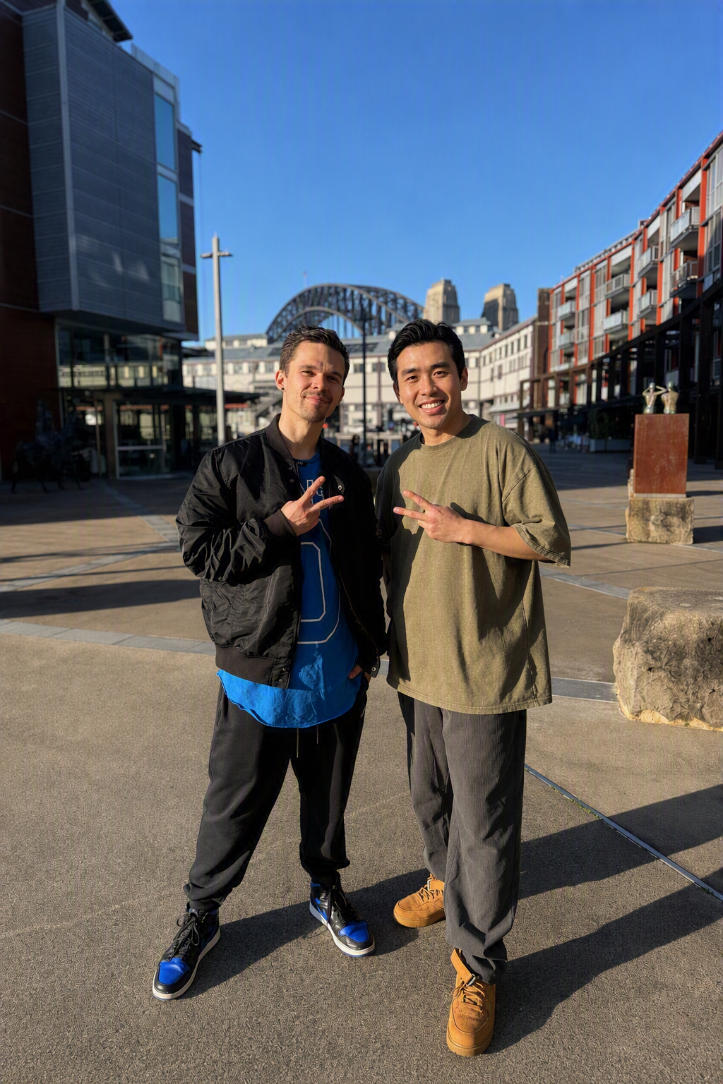 James and Clark standing together in front of Sydney Harbour Bridge